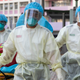 Medical staff wearing personal protective equipment as a precautionary measure against the COVID-19 coronavirus while entering the Lei Muk Shue care home in Hong Kong on August 23, 2020.